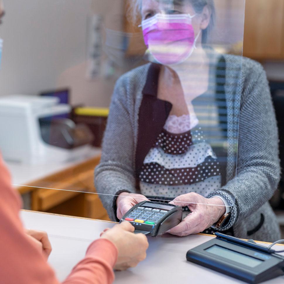 Woman paying at a doctor's office