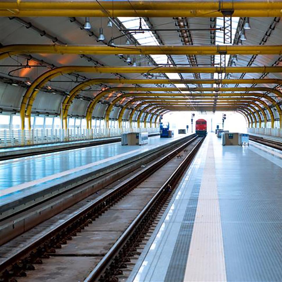 Red train approaching station 