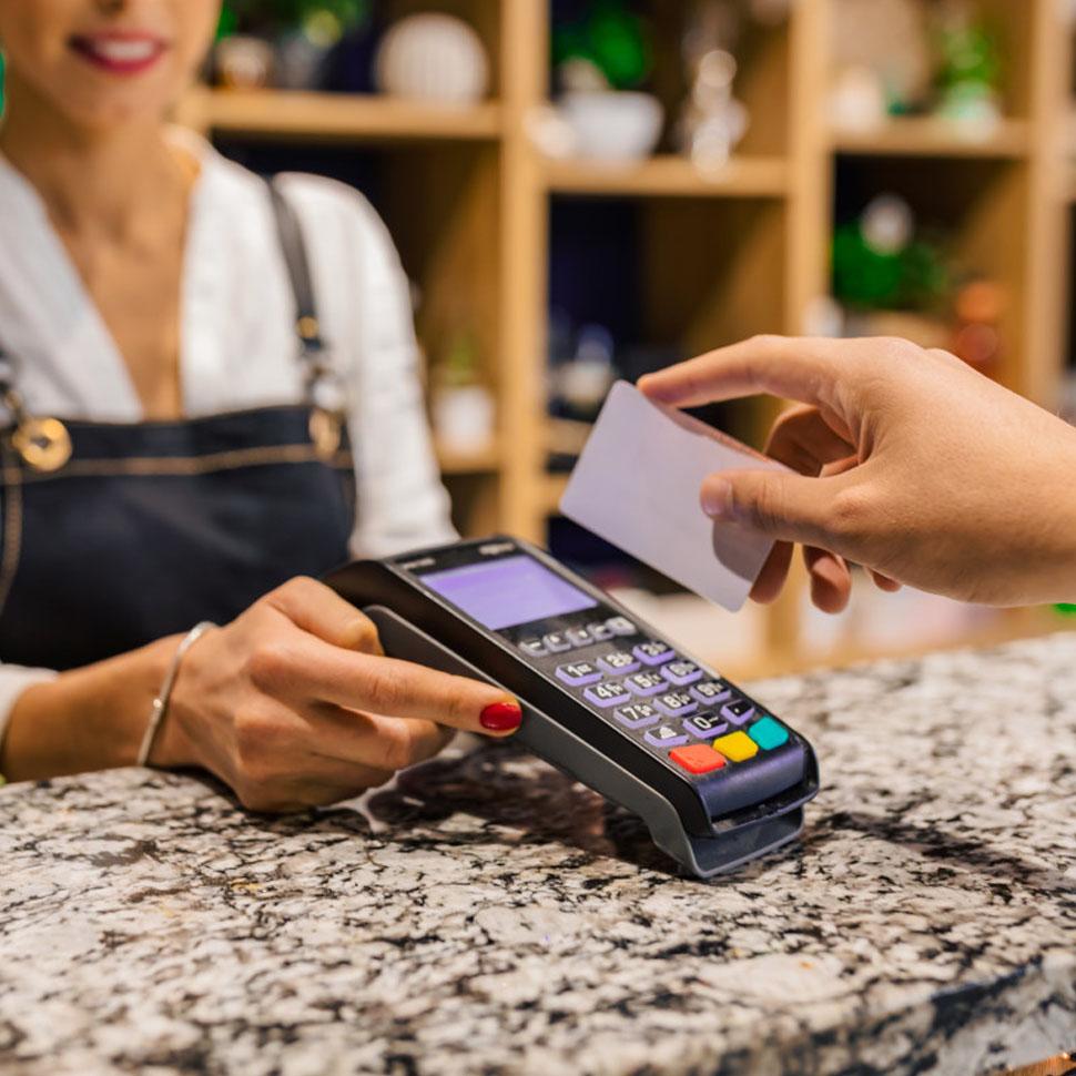 card swipe on a terminal sitting on a counter