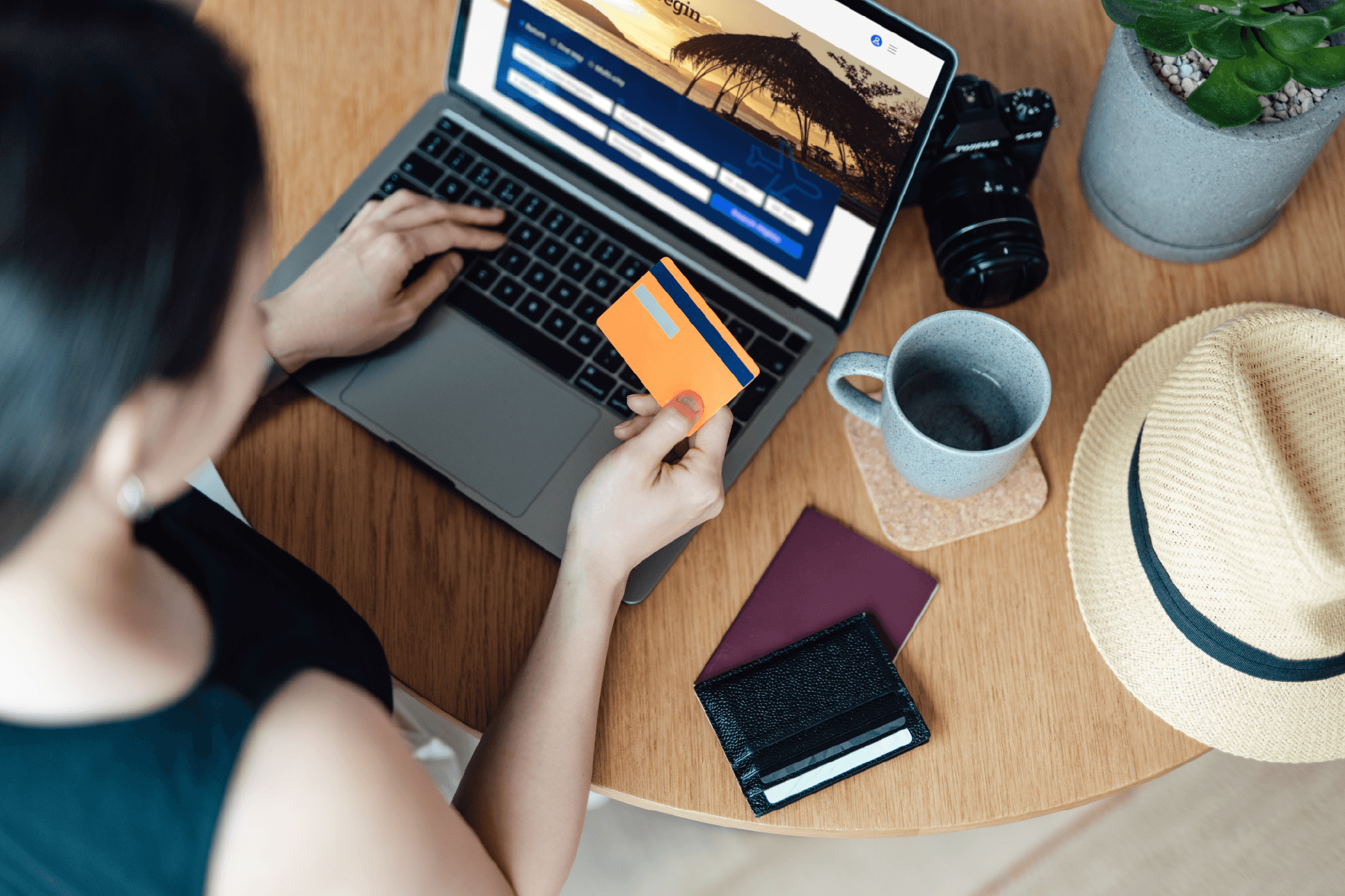 Woman entering card numbers on computer