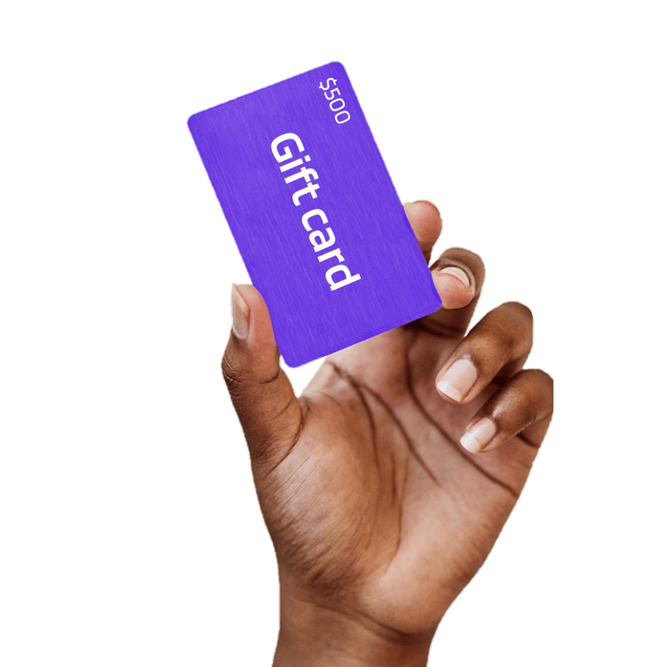 Hand holding a purple gift card with white text reading "Gift card" and "$500" against a white background.
